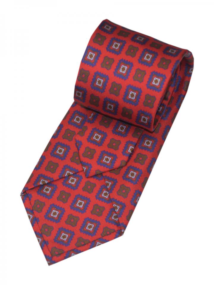 Red tie with purple  geometric pattern detail