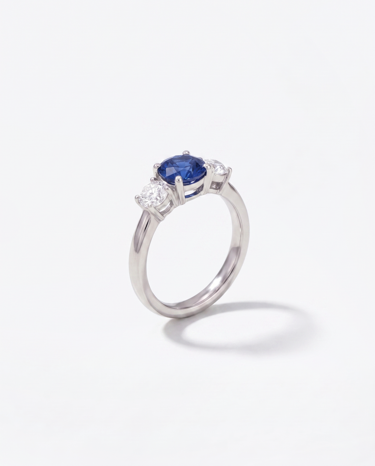 Blue Sapphire Solitaire, front hero view of the ring on a plain background