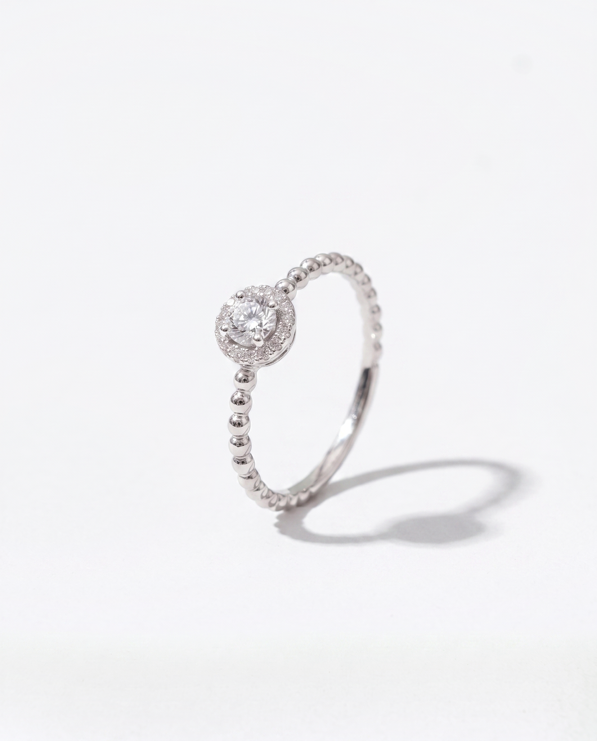 Diamond Solitaire, front hero view of the ring on a plain background