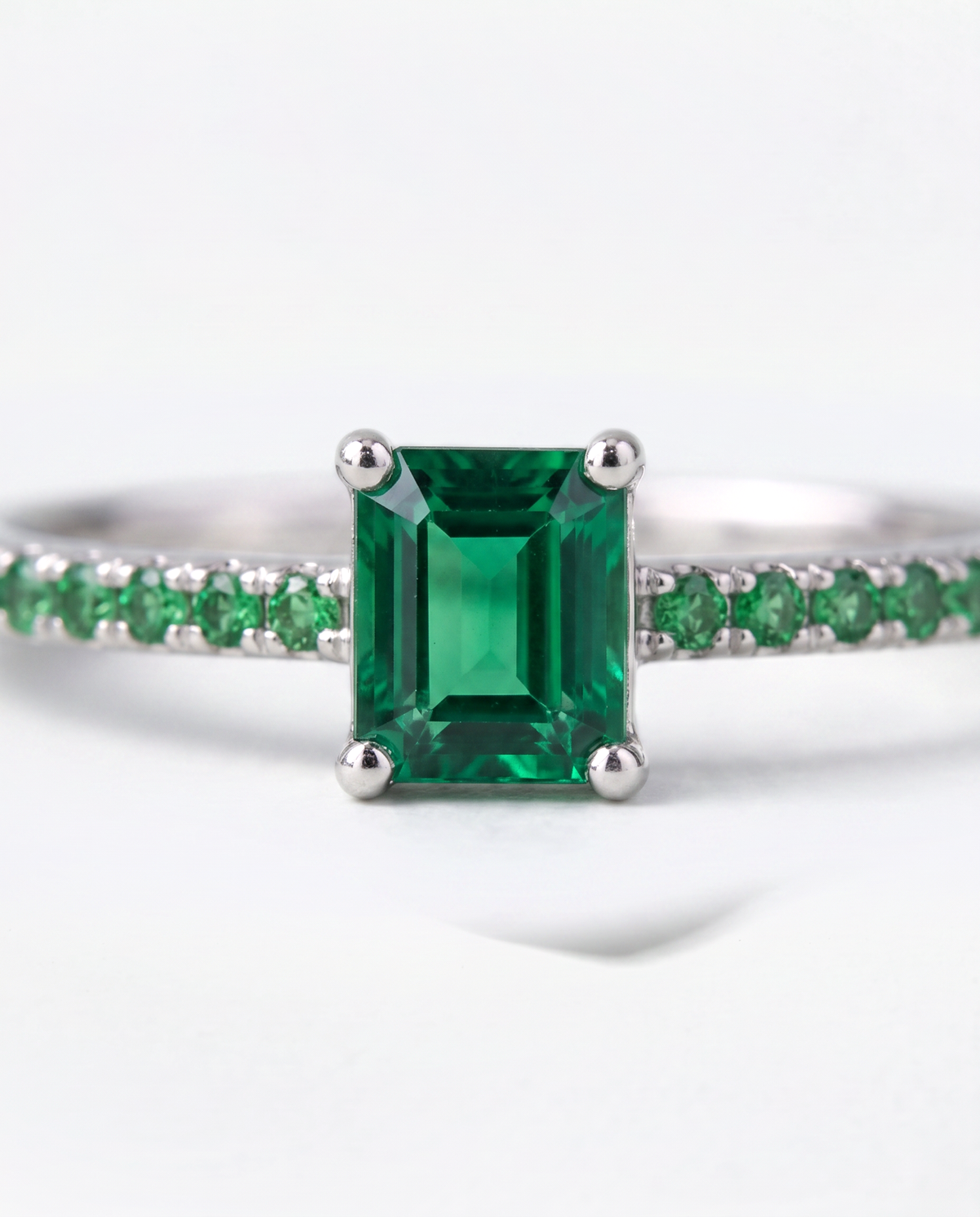 Emerald and Tsavorite ring, macro close-up of the stones