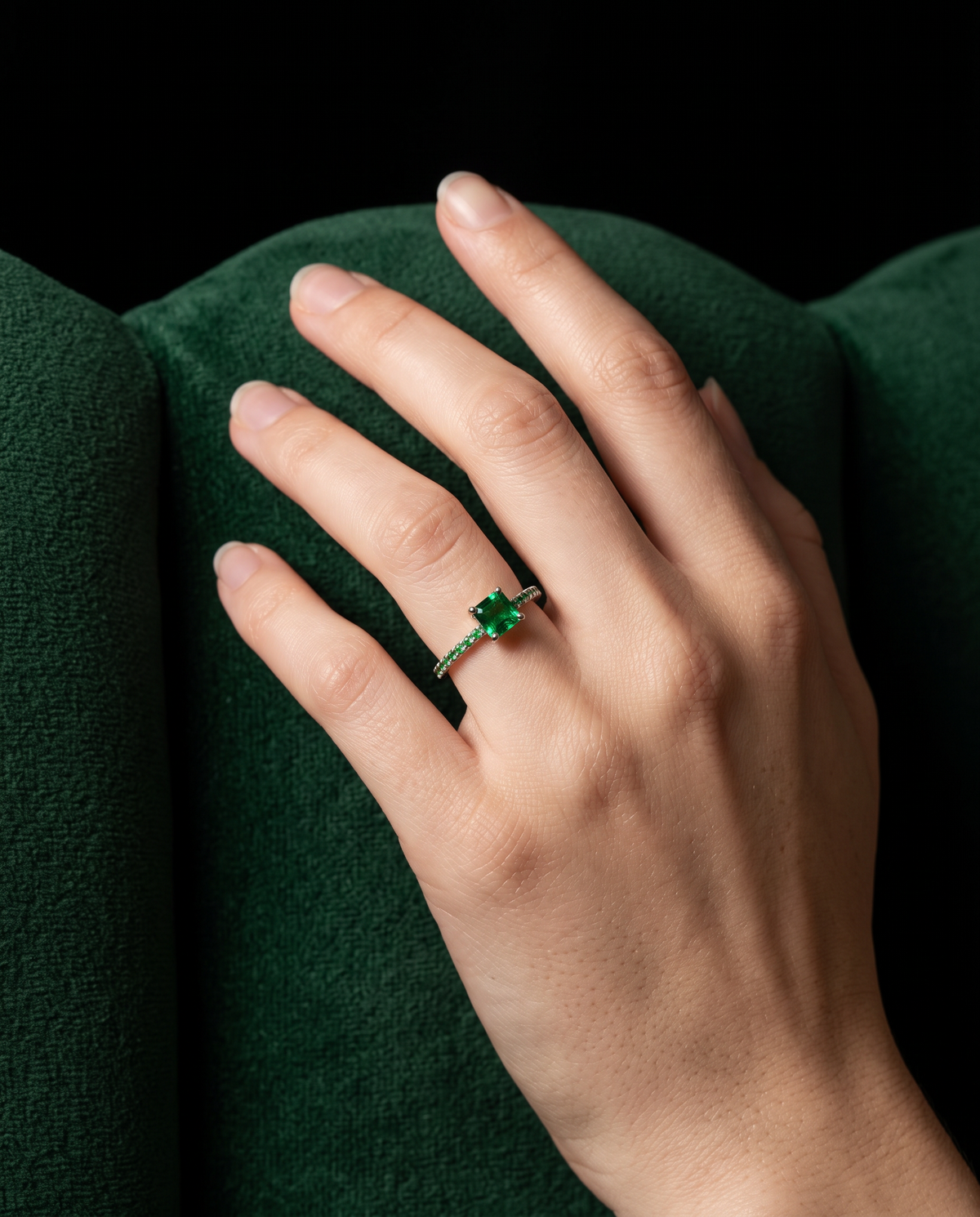 Emerald and Tsavorite ring, worn on a hand