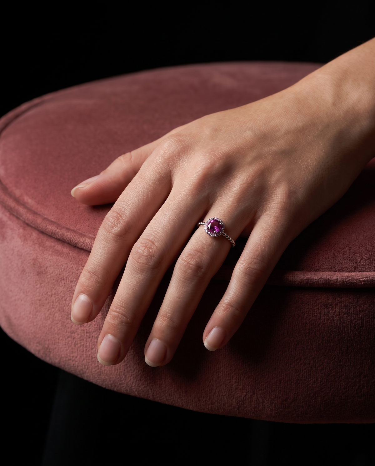 Pink Sapphire Halo, ring worn on a hand
