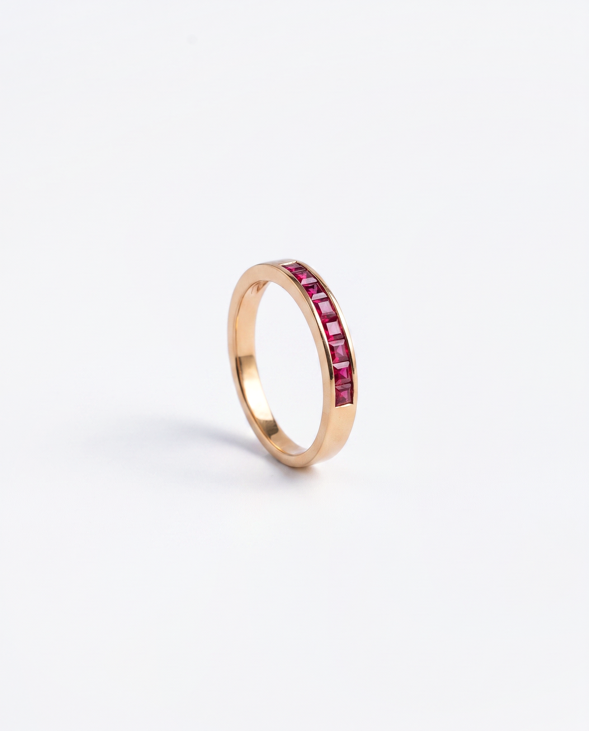 Ruby Channel, 18K yellow gold ring set with rubies, side profile showing the depth of the band