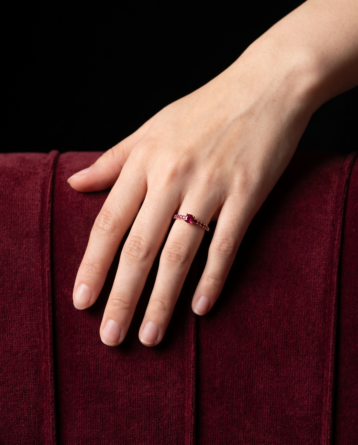 Ruby Half-Eternity, worn on a hand